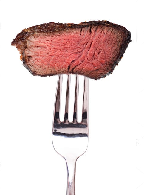Fork_483x652 Fork holding perfectly cooked steak